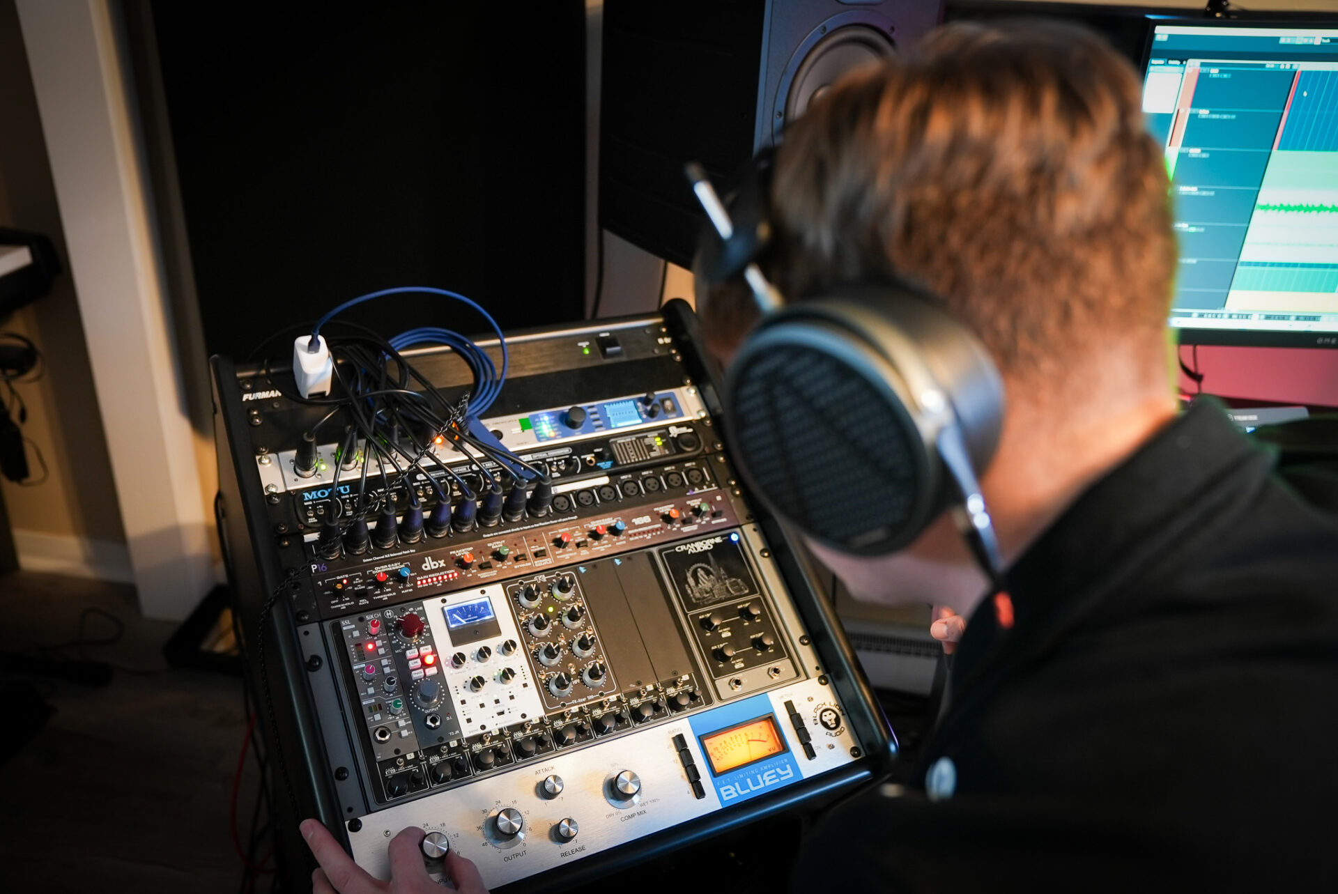 Nick Cesarz adjusting the input gain on the BLA Bluey Compressor